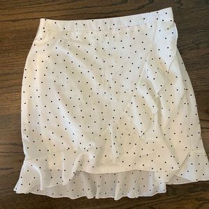 White mini skirt with black polka dots